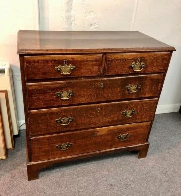A George III oak chest of two short