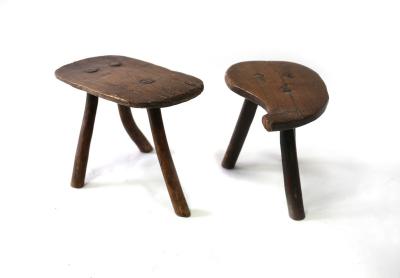 A small three-legged elm stool,