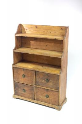 A Victorian pine cabinet with shelves