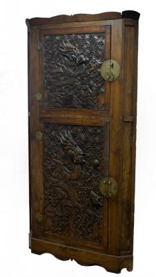 A Chinese corner cupboard enclosed
