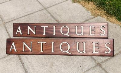 A pair of signs for Antiques  2dcae9