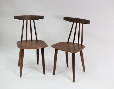 A pair of Danish teak stick back chairs