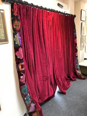 A pair of crimson velvet curtains