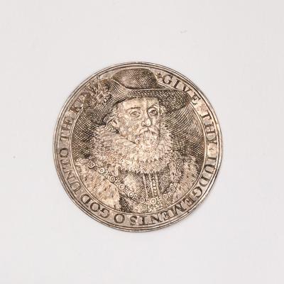 An engraved silver counter, James I