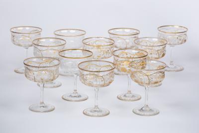 A set of twelve engraved and gilt champagne