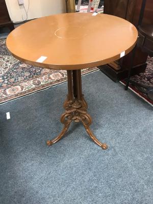 A circular mahogany table on a