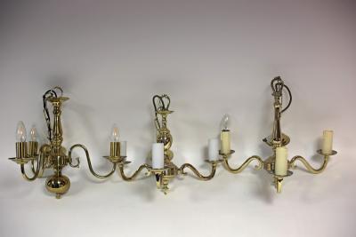 A Dutch brass three-light chandelier