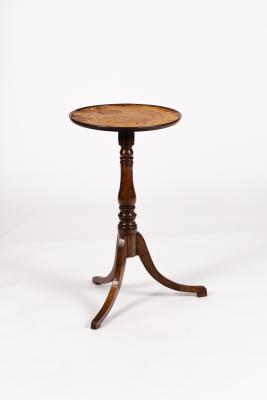 A small circular table with a leather