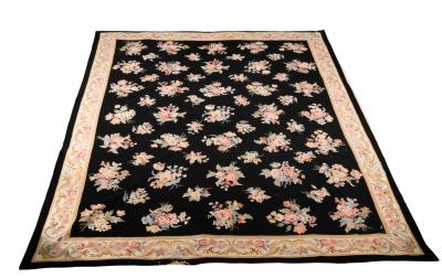 An Aubusson style wool carpet decorated