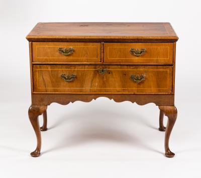 A walnut chest of one long and two short