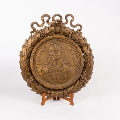 A gilded decorative plaque of Sir