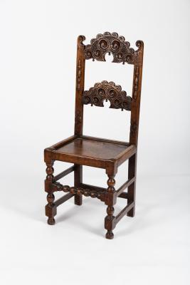 An oak single chair with pierced