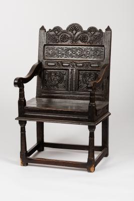 A carved oak Wainscot chair, the panel