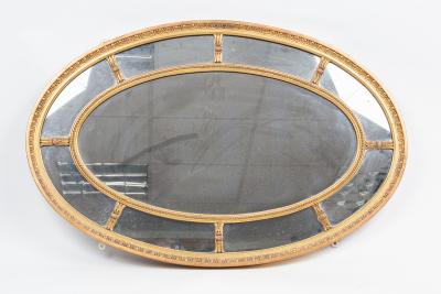 A George III style oval gilt framed