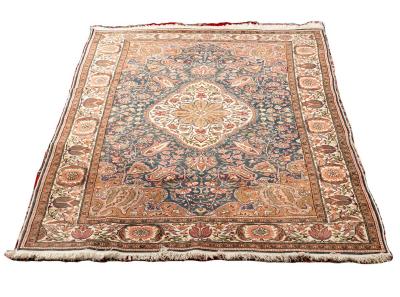 An Eastern rug with central floral