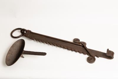 A wrought iron pot hook with ratchet