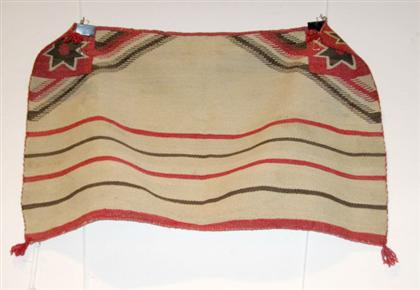    	Navajo childs wearing blanket 