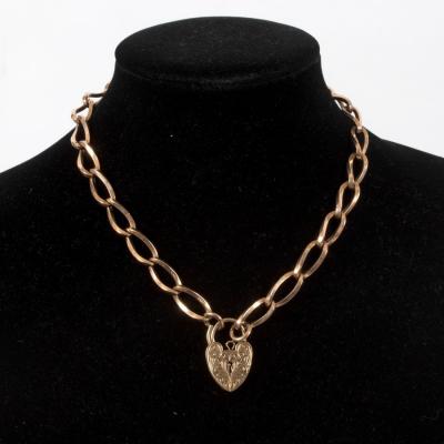 A 9ct gold chain with a heart-shaped