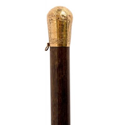 A malacca walking cane with gold
