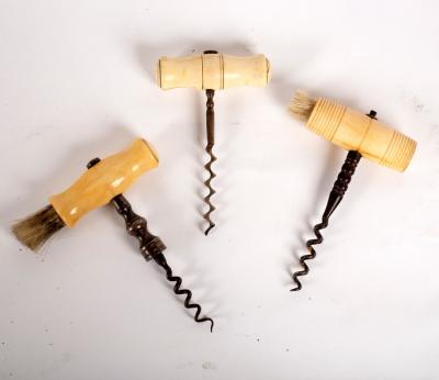 A steel corkscrew with ivory handle