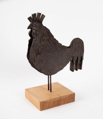A bronze model of a cockerel/on a wood