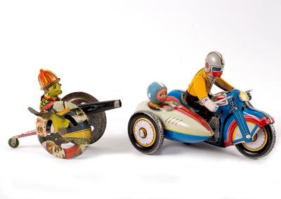 A tinplate motorcycle and sidecar