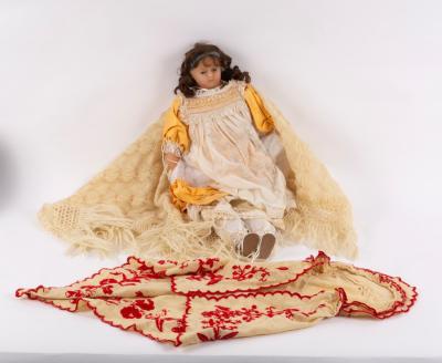 A Victorian wax doll with glass