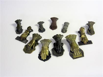     	Eleven brass and tin hand-form