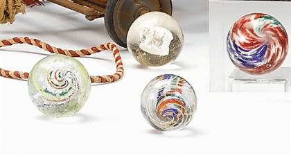     	Four glass marbles    19th century