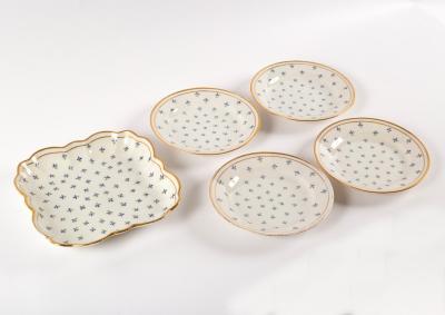 Four dessert plates and a square dish,