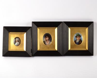 Three framed porcelain plaques,
