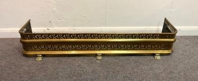 A brass fire curb, 121cm wide