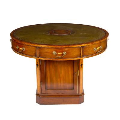 A mahogany drum-shaped rent table,