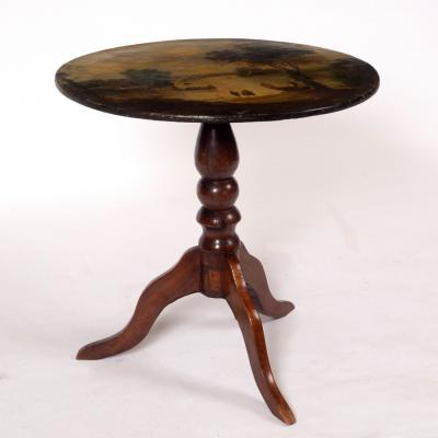 A circular table, the top painted a