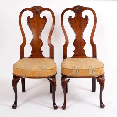 A pair of walnut single chairs