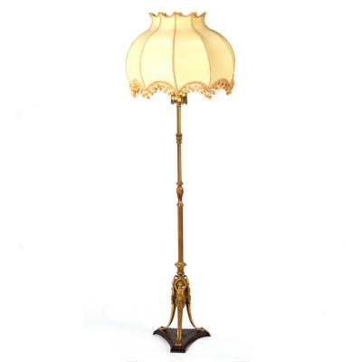 A brass standard lamp of reeded