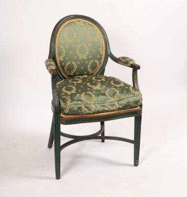 A green painted open armchair with oval