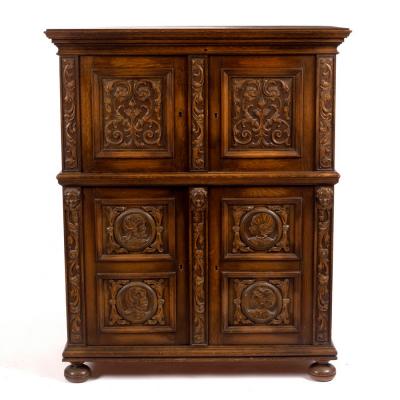 An oak cupboard enclosed by a pair