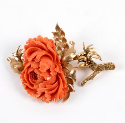 A coral brooch of flower form, set in