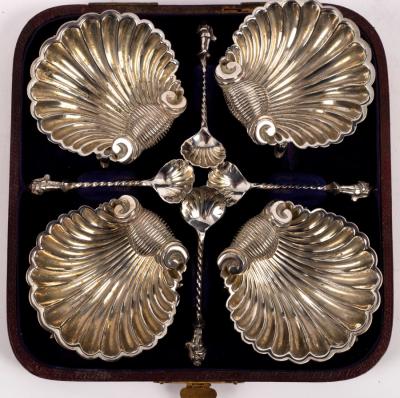 A set of four plated shell-shaped