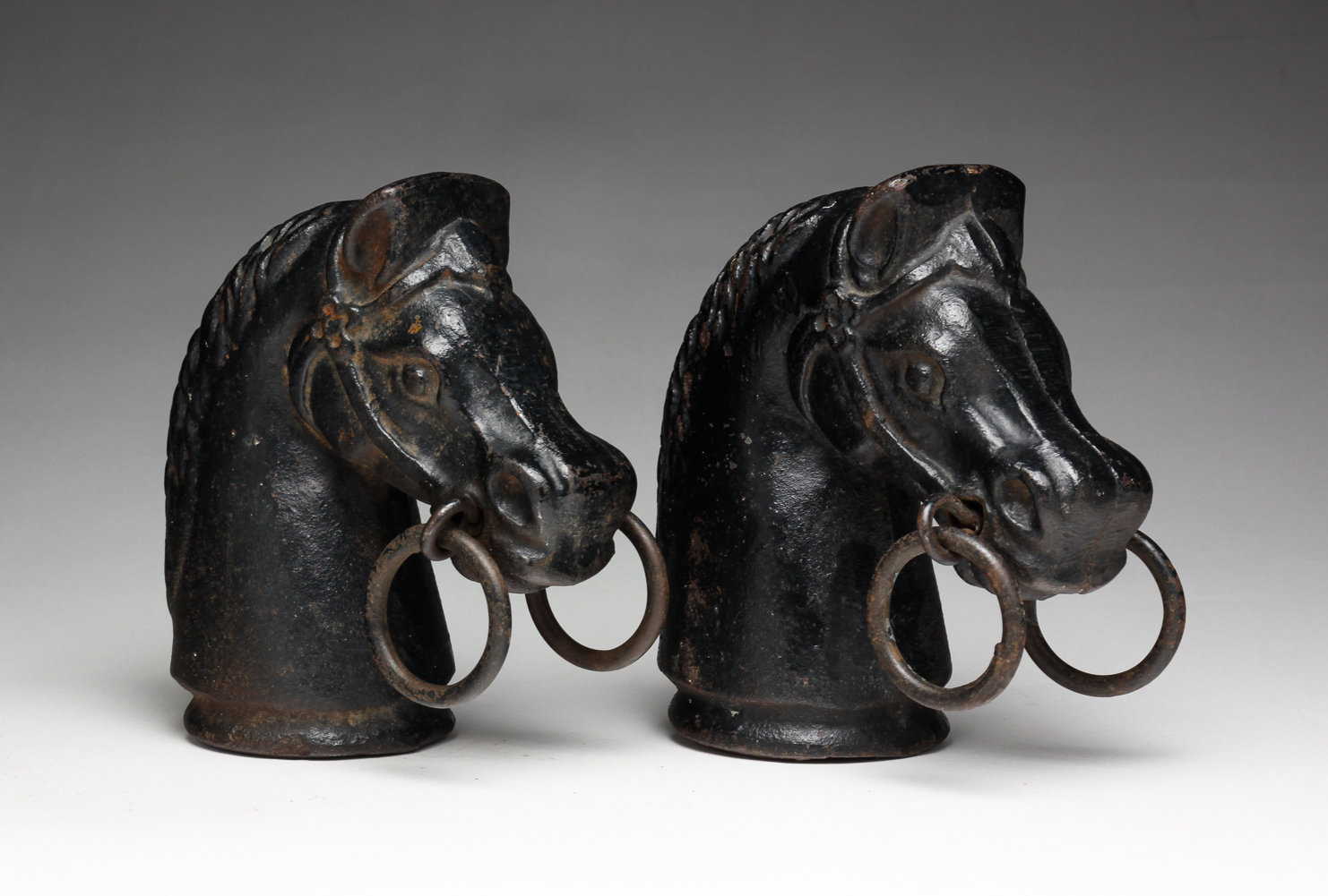 TWO CAST IRON HORSE HEAD HITCHING