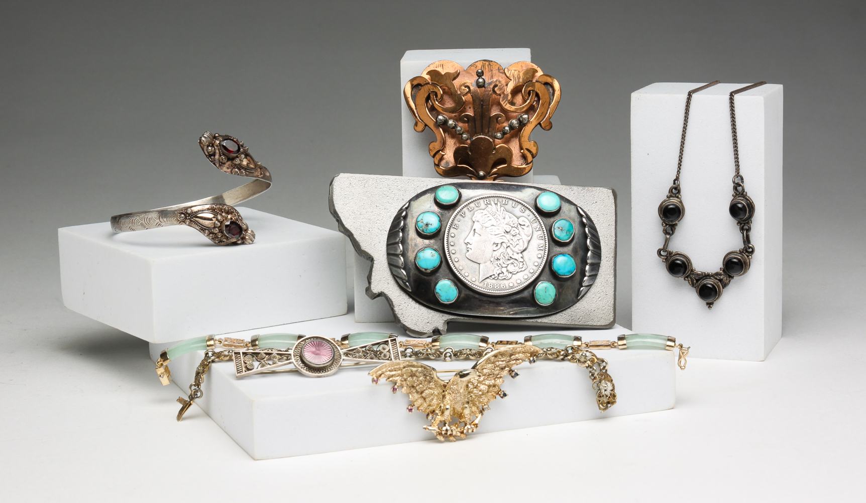 GROUP OF JEWELRY AND BELT BUCKLE.