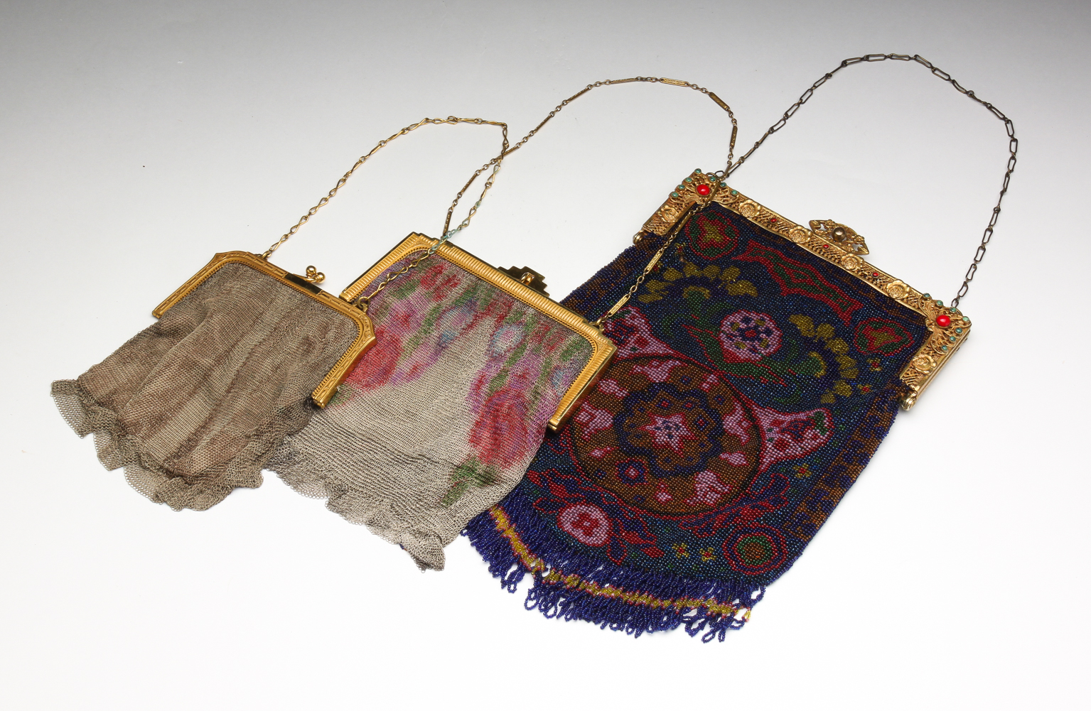THREE VINTAGE EVENING BAGS. Early