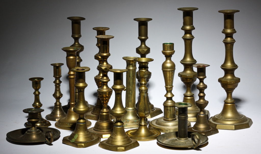 GROUP OF BRASS CANDLE HOLDERS.