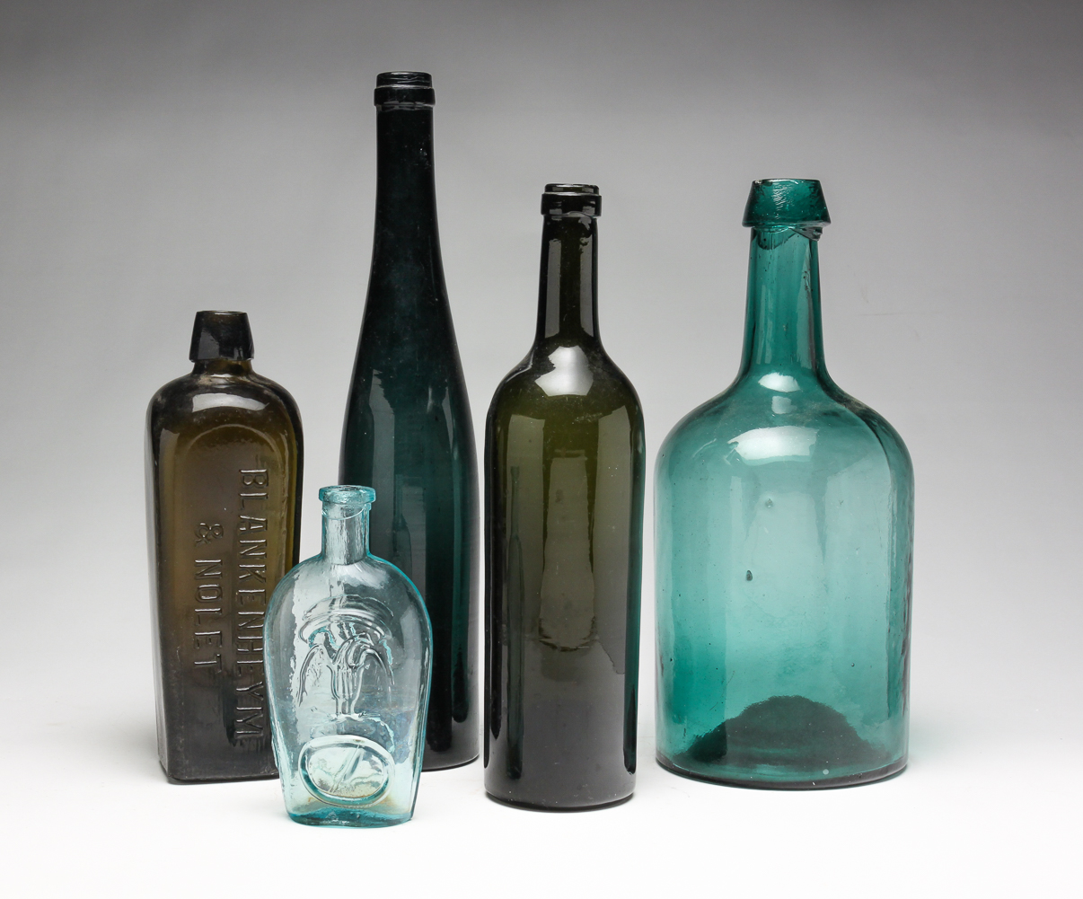 FIVE BLOWN GLASS BOTTLES. American