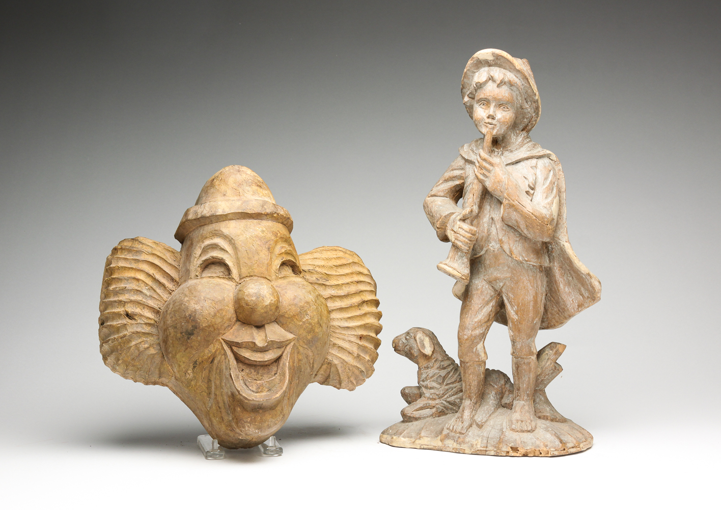 TWO WOODEN MOLDS OF SHEPHERD AND CLOWN.