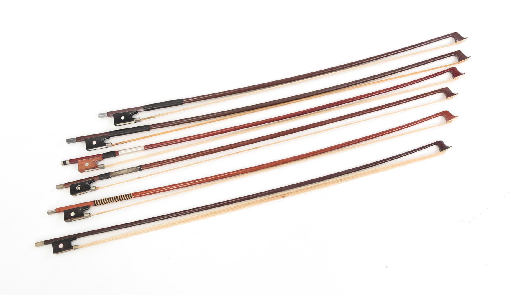 SIX VIOLIN BOWS. Twentieth century.