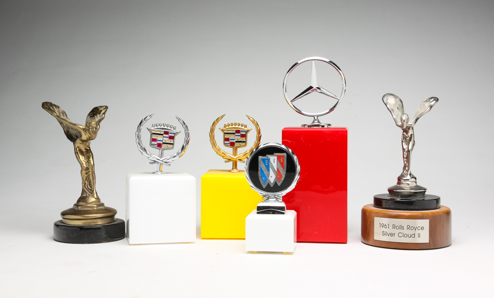 SIX AUTOMOBILE HOOD ORNAMENTS INCLUDING