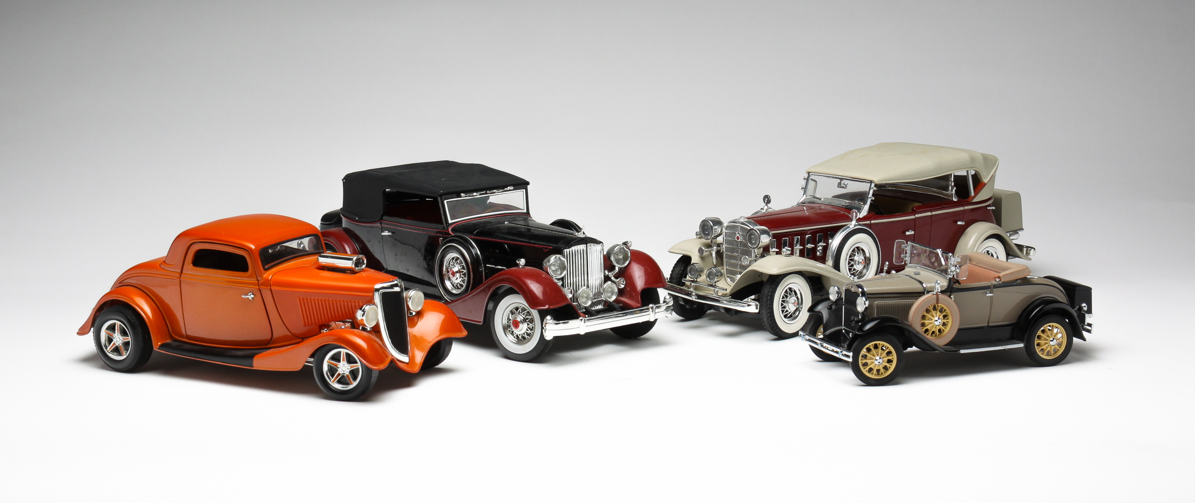 FOUR DIECAST CARS. Late 20th century,