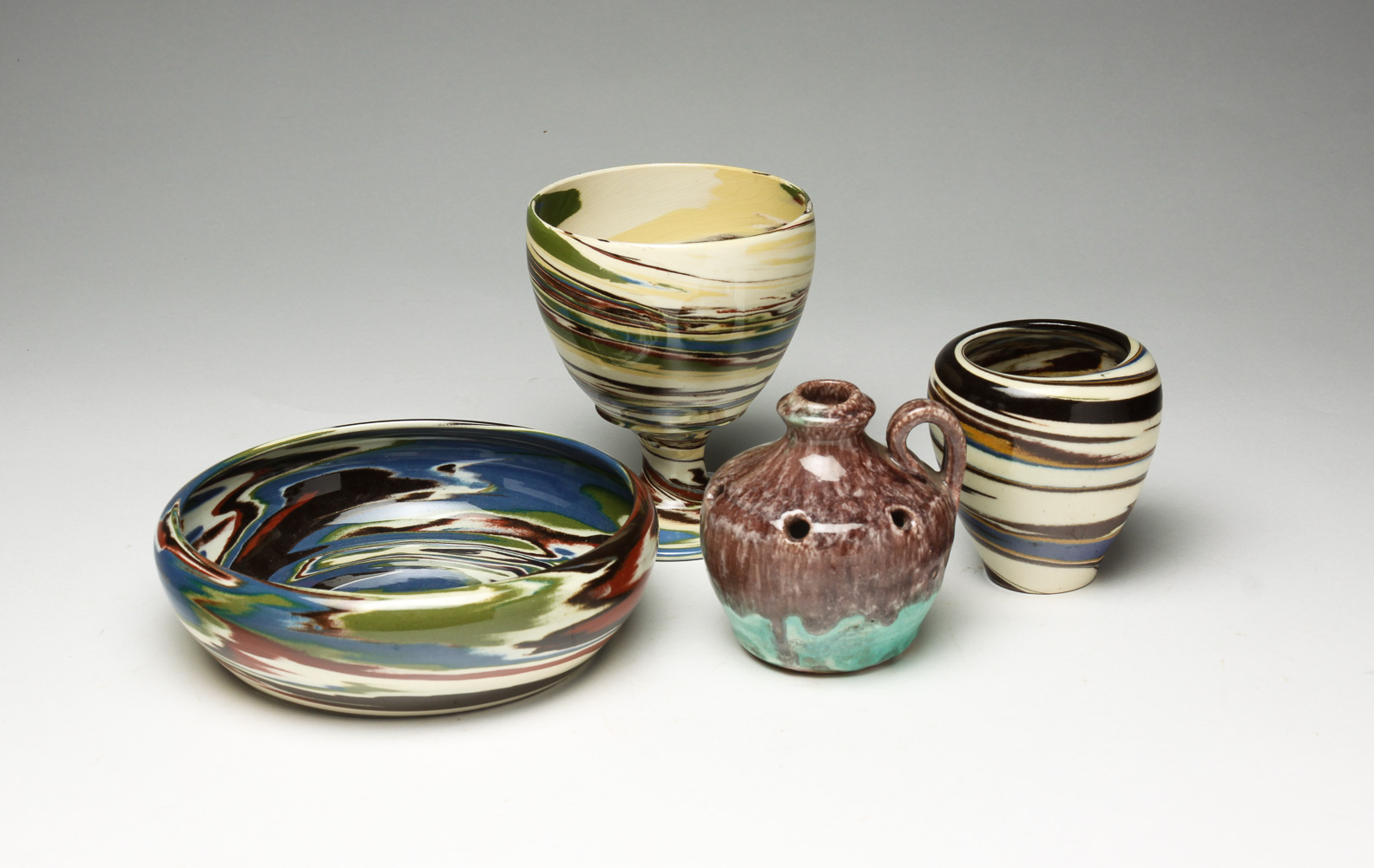 FOUR PIECES OF AMERICAN ART POTTERY.